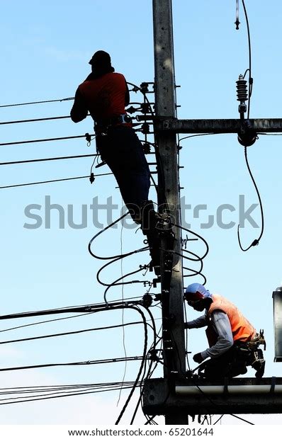 Silhouette Electrician Man On Electric Poles Stock Photo 65201644