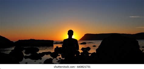 Silhouette Man That Meditating Sunset Stock Photo 660821731 Shutterstock