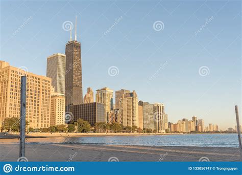 Reflection Of Chicago Skyscraper On Michigan Lake At Sunrise Stock
