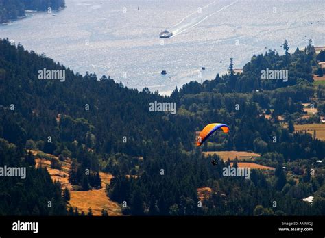 Paraglider Flying Over Salt Spring Fulford Harbour And Bc Ferry In The
