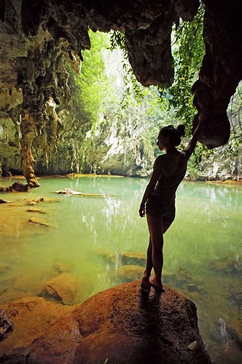 Young Woman Standing By A Hidden Lagoon Photograph By Henn Photography