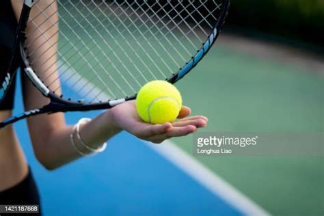 Woman Hand Holding Tennis Ball Photos And Premium High Res Pictures
