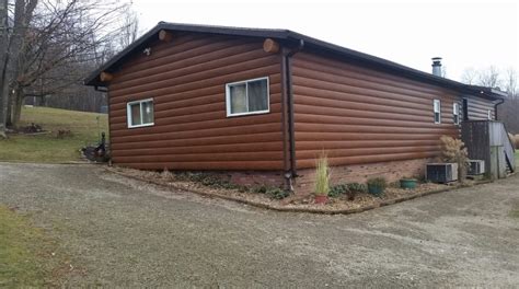 Turn any house or mobile home into a beautiful log cabin! Double-Wide Mobile Homes That Look Like Log Cabins