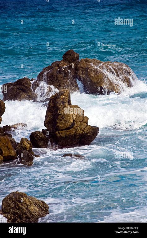 Wave Breaking On Rocky Shore Stock Photo Alamy