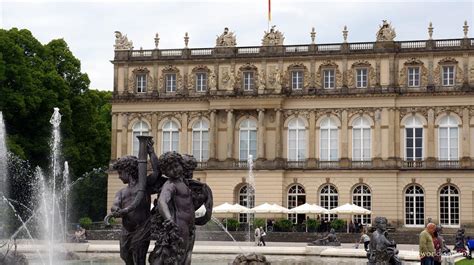 Herrenchiemsee palac_couple strolls through the palace park_leitmotif german summer cities ©dzt (günter standl). Touring European Castles and Palaces - The World Is A Book