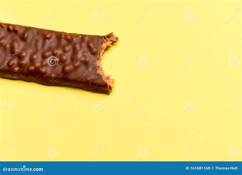Tasty Chocolate Bar With A Bite Taken Out Isolated High Calorie Snack