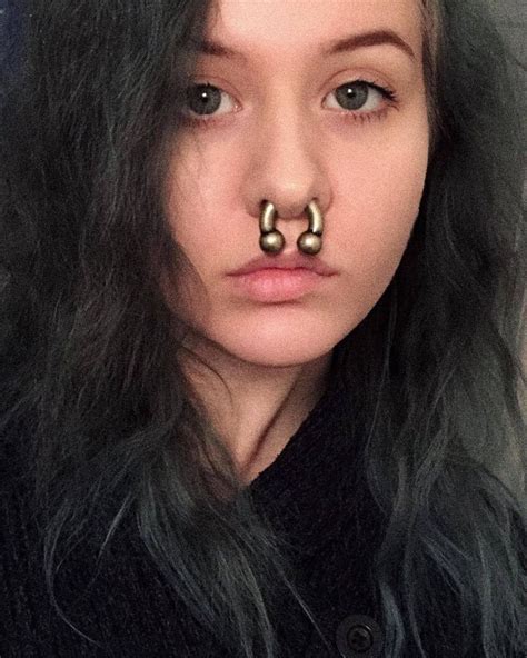 A Woman With Fake Nose Rings On Her Nose