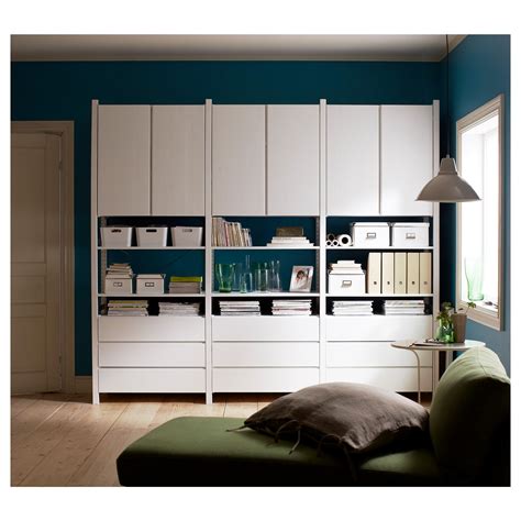 It features gold leaf on the back which creates a striking backdrop for bar accessories. Ikea Ivar cabinets and drawers painted white and arranged ...