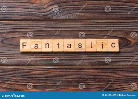 Fantastic Word Written On Wood Block Fantastic Text On Cement Table