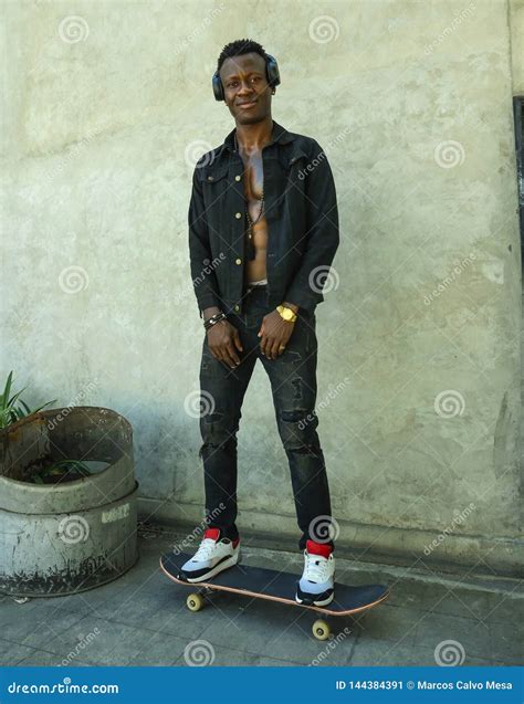 Young Attractive And Happy Black African American Man Riding Skate