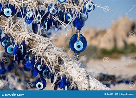 Many Traditional Turkish Evil Eye Bead Amulets On The Tree Nazar Boncuk From Blue Glass Stock