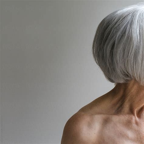 Senior Topless Woman On Simple Grey Background By Stocksy Contributor Rob And Julia Campbell