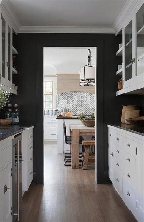 Black And White Butlers Pantry Features Walls Painted Black Lined With