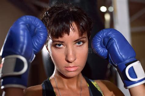 Close Up Of Woman With Blue Boxing Gloves Ready To Fight Stock Image