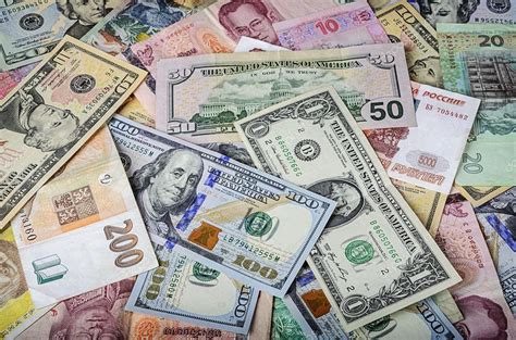 A Collection Of Various Foreign Currencies From Countries Spanning The