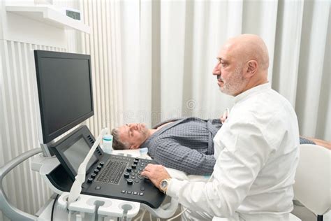Professional Ultrasound Specialist Is Examining Health Of Patient In