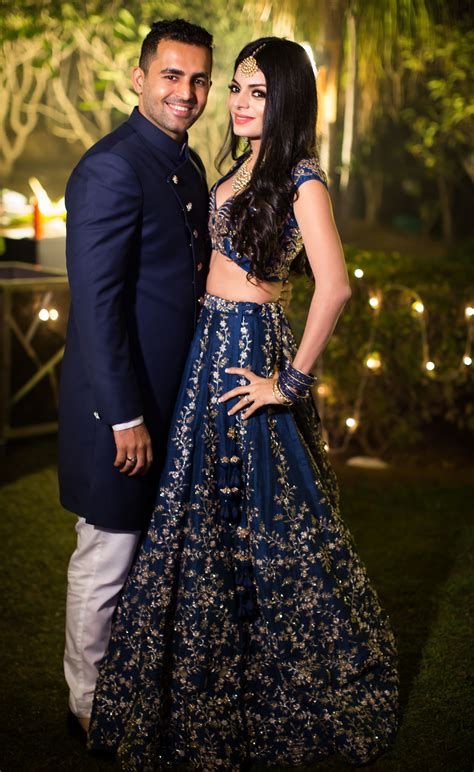 Naina And Ankit In Coordinated Blue And Gold Sherwani And Lehenga At Their Sangeet Matching