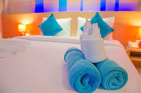 Blue Towel On The Bed At A Luxury Hotel Photo Background And Picture