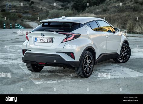 Rear Angle Close Up Of A White Toyota C Hr Chr On A Helipad Hills And