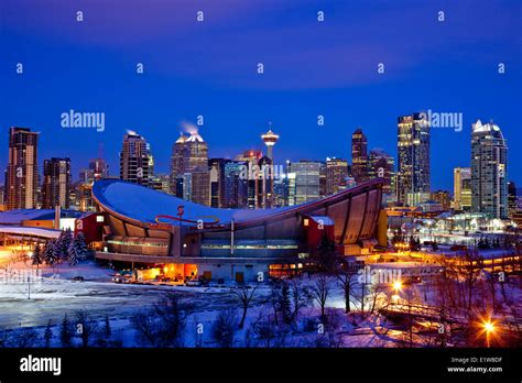 Calgary Skyline At Night In Winter With Scotiabank Saddledome In