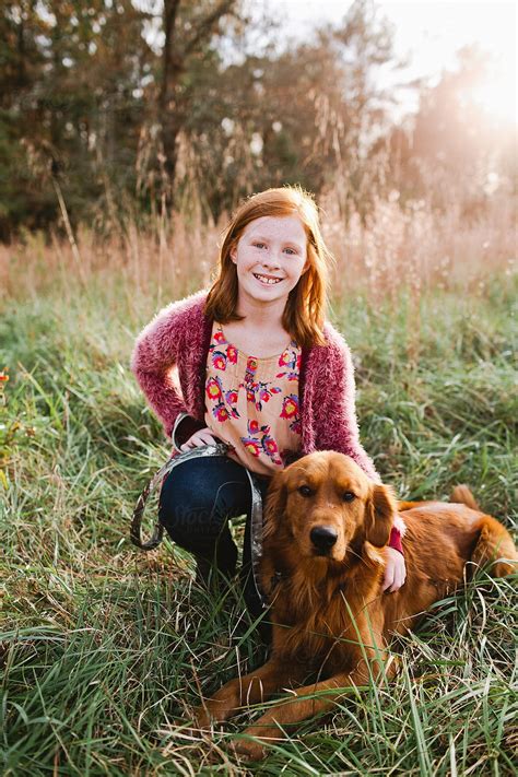 Redheaded Girls With Her Dog By Stocksy Contributor Erin Drago