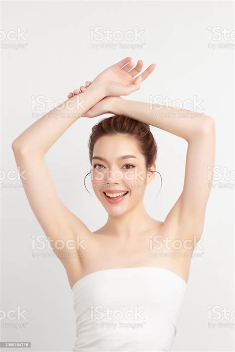 Beautiful Young Asian Woman Lifting Hands Up To Show Off Clean And