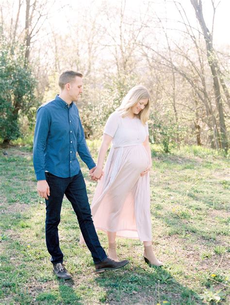 Pastel Photo Of Husband And Pregnant Wife Walking Hand On A Sp Maternity Photography Couples