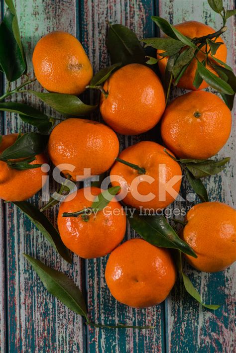 Natural Sweet Clementines On Rustic Table From Above Stock Photo