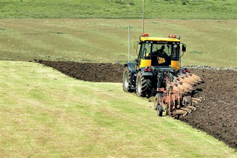 Tractor Ploughing A Field Photograph By Simon Fraserscience Photo