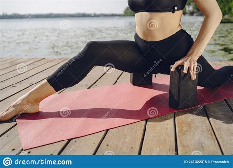 Woman Practicing Advanced Yoga By The Water Stock Photo Image Of