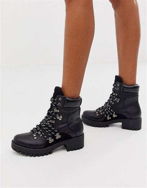 missguided chunky hiking ankle boot with contrast laces in black asos