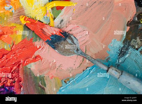 Palette Knife With Oil Painting Colors On Pallette Background Stock