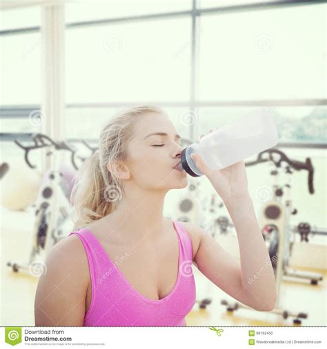 Composite Image Of Beautiful Healthy Woman Drinking Water