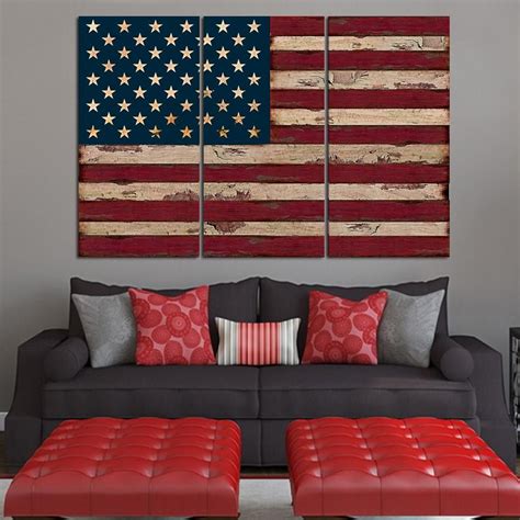 american flag wall art canvas combine with dark grey sofa and red ottoman in the living room