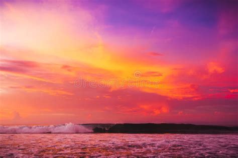 Waves In Ocean At Bright Pink Sunset Or Sunrise Ocean With Warm Sunset