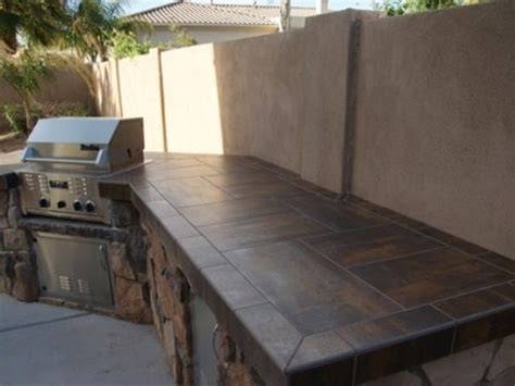 Cedar cabinetry and stainless steel countertops give this outdoor kitchen a modern feel. Best 25+ Outdoor kitchen countertops ideas on Pinterest ...