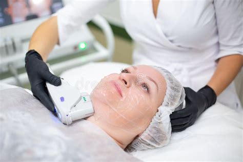 A Woman In A Cosmetology Office Receives A Smas Lifting Procedure Non