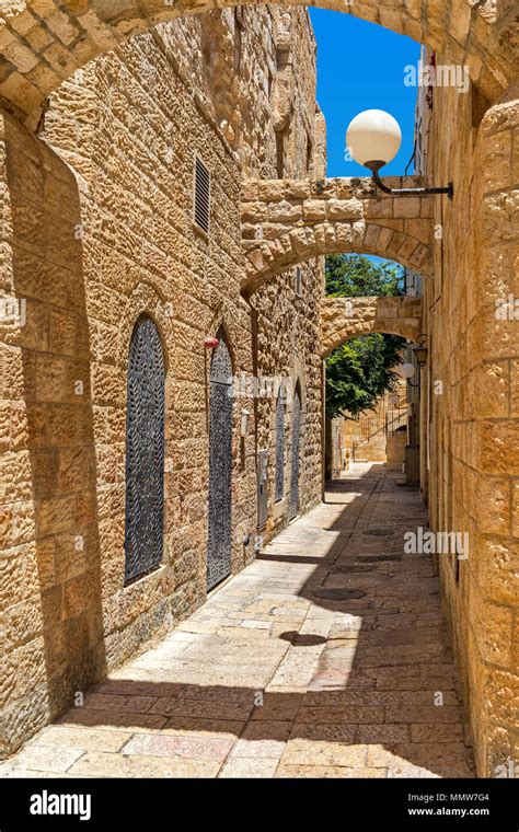 Narrow Street Among Old Stone Houses In Jewish Quarter In Old City Of