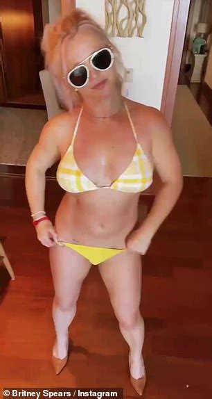 Britney Spears Slips Back Into Her Yellow Thong Bikini And Shows Off Her Backside As She Dances