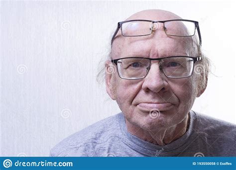 An Old Man With Two Glasses Some Glasses On The Nose Others On The Forehead Portraitcopy