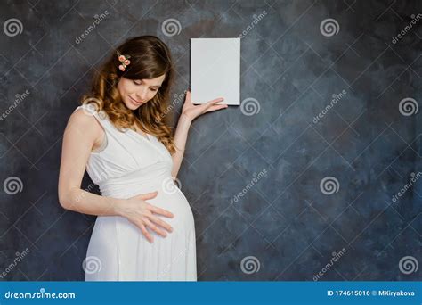 Pregnant Young Woman With Mockup Poster Frame Expectant Mom Holding