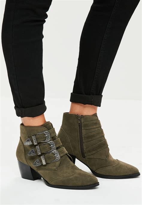 These Boots Feature A Luxe Khaki Hue Faux Suede Fabirc And A Buckle