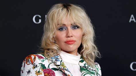 Miley Cyrus Debuts Black Streaks In Her Platinum Blonde Hair — See