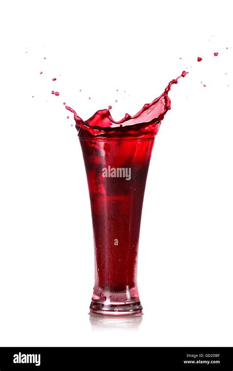 Red Juice Splash In A Glass Isolated On White Background Stock Photo