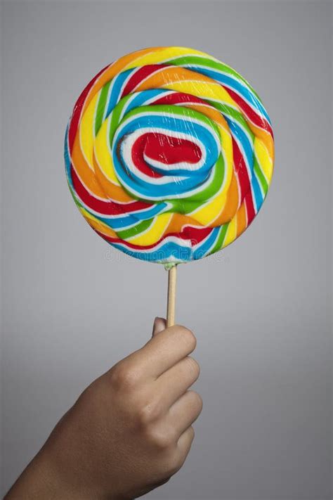 Hand Holding Colorful Lollipop Candy Stock Image Image Of Birthday