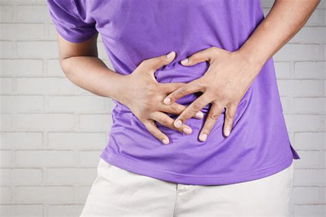 Young Man Suffering Stomach Pain Close Up Stock Photo Download Image