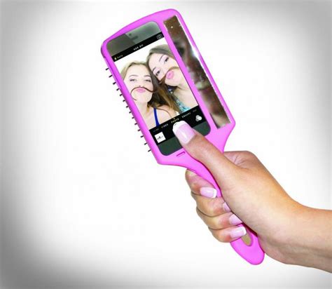 the selfie brush is an iphone case and hair brush