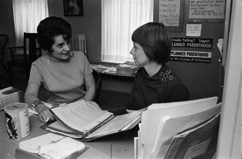Volunteer receptionists Mrs. Kenneth M. Case and Susan Olds at Planned