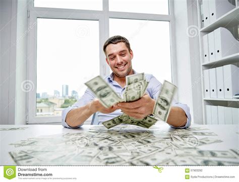 Happy Businessman With Heap Of Money In Office Stock Photo Image