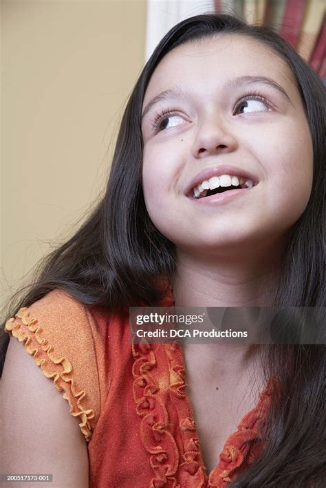 Girl Smiling Looking Upwards High Res Stock Photo Getty Images